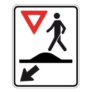 Passage pour piétons sur un dos d'âne allongé ou un carrefour surélevé